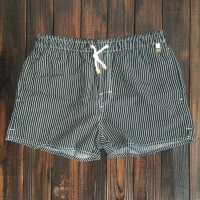 Men's stylish beachwear: comfortable, quick-dry swim shorts for summer fashion, poolside, and vacation.