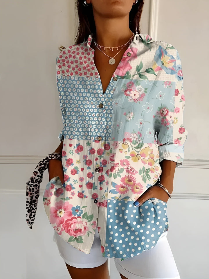 Stylish women's printed blouse, button-front, with rolled three-quarter sleeves. Versatile fashion top.