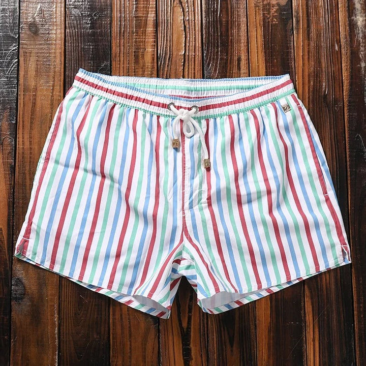Men's quick-dry swim shorts. Comfortable, stylish swimwear ideal for beach, poolside, and summer vacation.