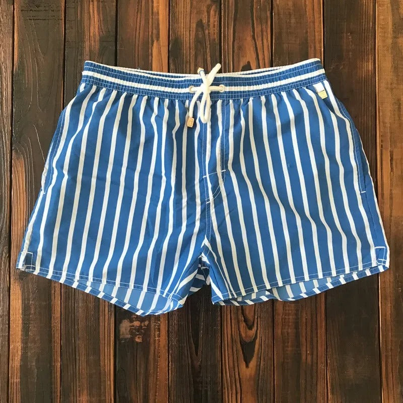 Men's stylish quick-dry swim shorts, perfect for beach, pool, or vacation. Comfortable summer swimwear.