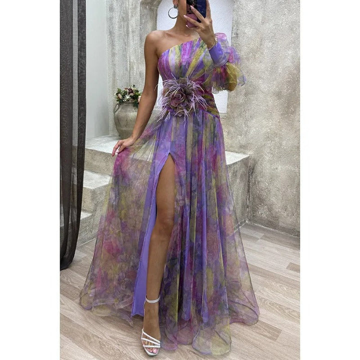 Stylish women's elegant floral maxi dress featuring an asymmetrical hem, ideal for summer formal wear.