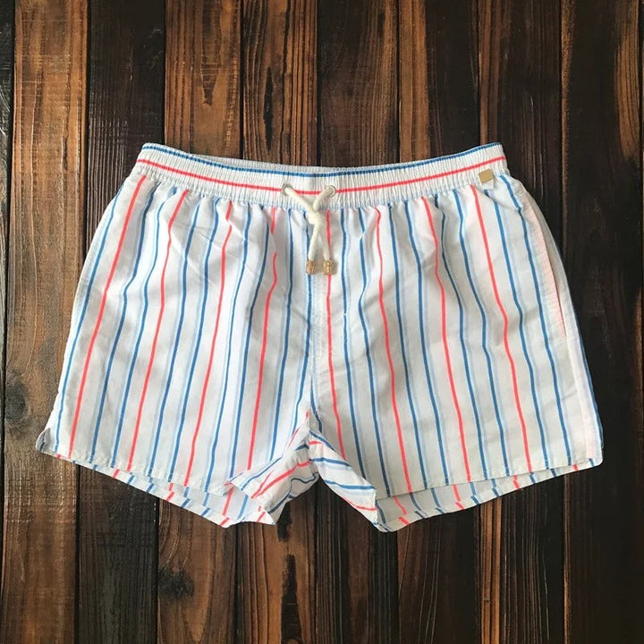 Comfortable men's swim shorts for beachwear. Quick-dry fabric, ideal for summer fashion and poolside style.
