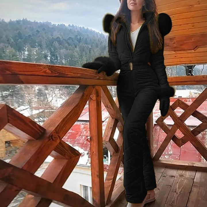 Sleek full-zip women's weather-resistant snowboard overall, a functional winter activewear outfit for snow.