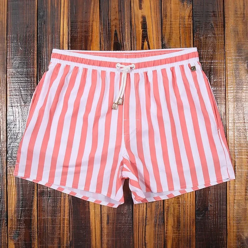 Stylish men's swim shorts for summer vacation. Comfortable, quick-dry beachwear and casual poolside fashion.