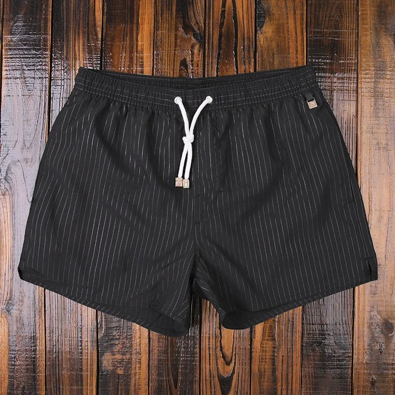 Men's stylish swim shorts, perfect for comfortable beachwear, quick-dry summer fashion, and poolside fun.