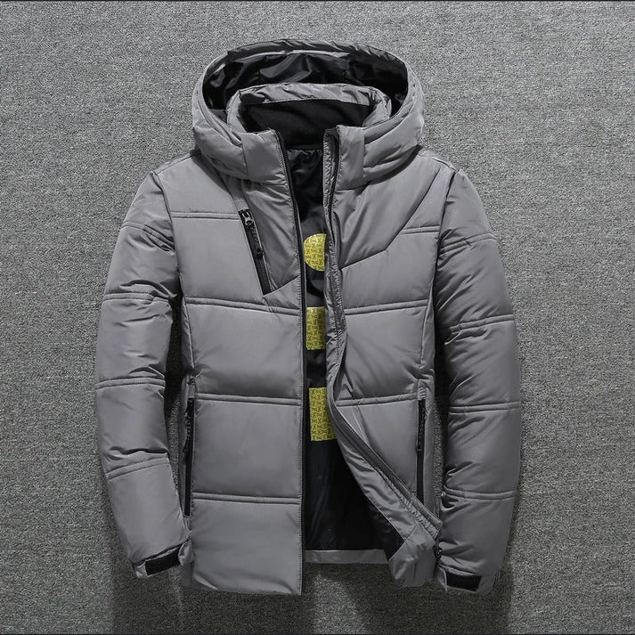 Men's warm casual puffer jacket with a hood and zip front, quilted for cold winter days and outdoor adventures.
