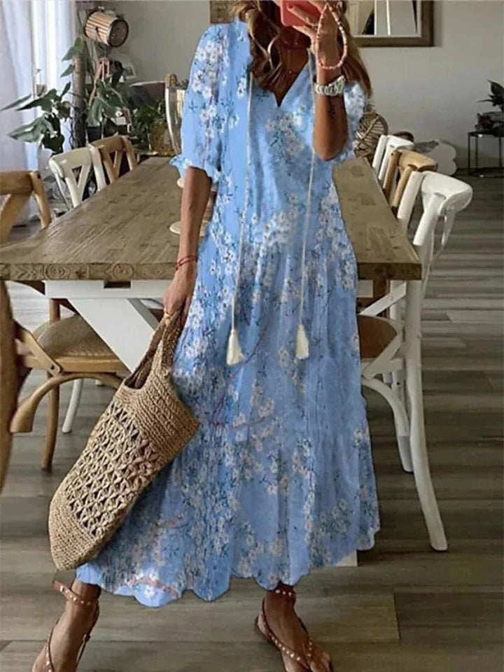 Comfortable women's long boho maxi dress with a vibrant floral pattern. Perfect casual summer wear, elegant for vacation.