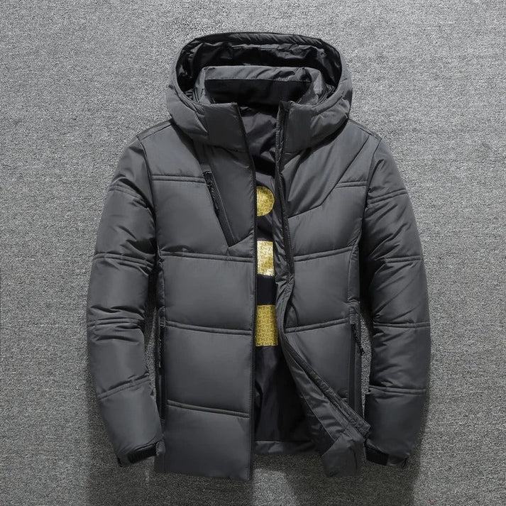 Stylish men's puffer jacket with hood, quilted design provides ultimate warmth for casual winter fashion.