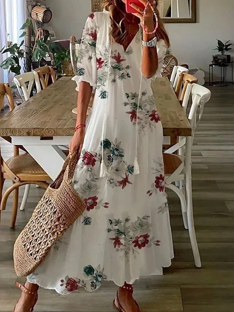 Bohemian floral print women's maxi dress. Elegant, comfortable, and flowy long summer dress, suitable for vacation wear.