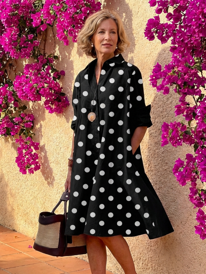 Flowy women's relaxed fit midi shirt dress with button front, collar & long sleeves, great for spring/summer comfort.