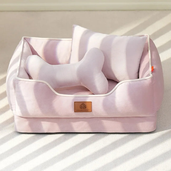 "Velvet-soft pet bed with cushion and bolster, shown in modern living room, offers comfort with Dutch velvet texture."