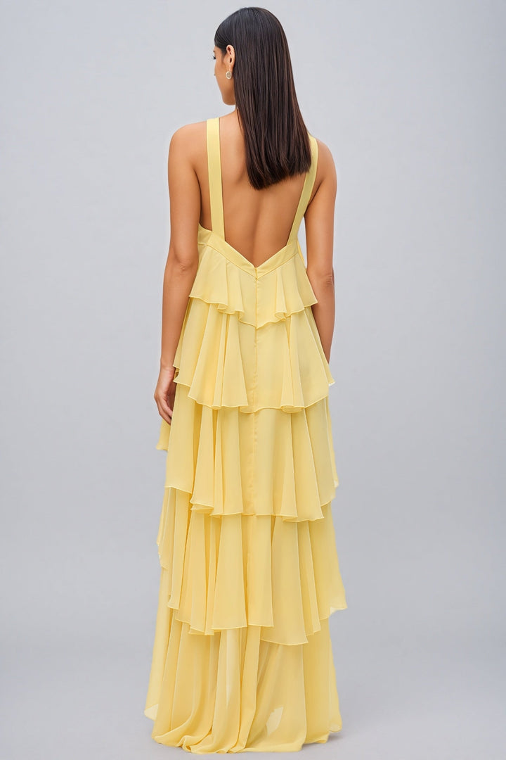 Beautiful yellow summer maxi dress for women, featuring a graceful layered skirt & elegant halter neck.