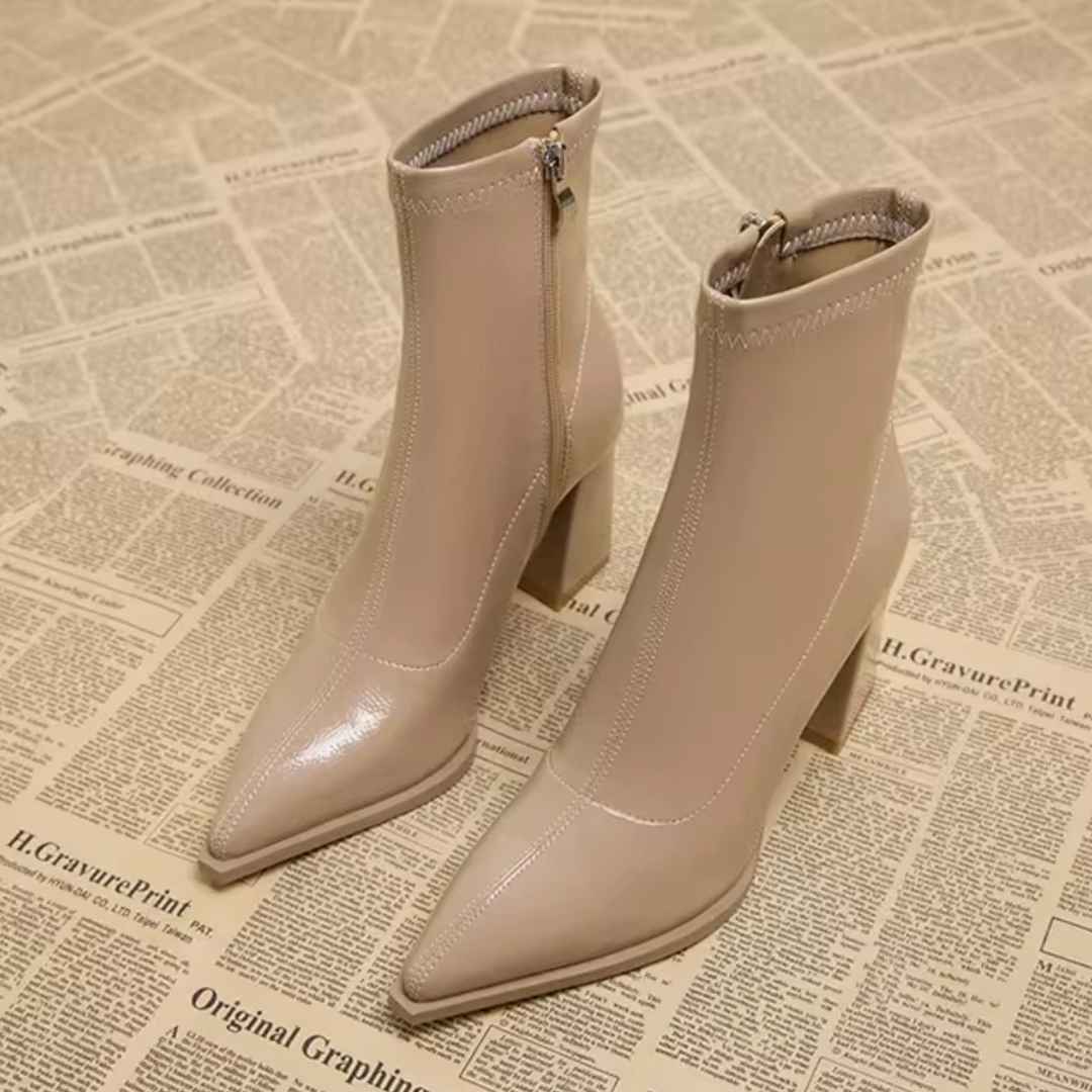 Versatile women's chic ankle boots. Pointed toe, block heel, & zipper closure for modern style & function. Fashion boots.
