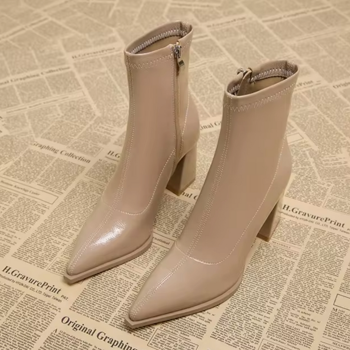 Versatile women's chic ankle boots. Pointed toe, block heel, & zipper closure for modern style & function. Fashion boots.