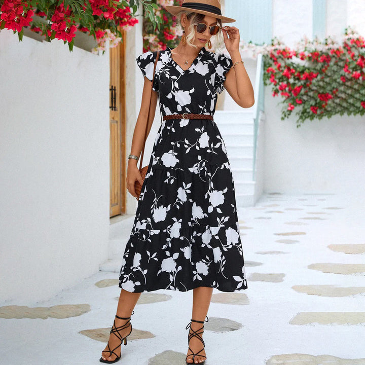 Vintage black V-neck midi dress for women, featuring elegant floral print, perfect for summer outings.