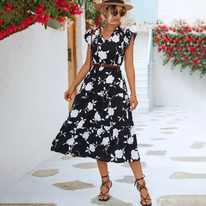 Vintage black V-neck midi dress for women, featuring elegant floral print, perfect for summer outings.