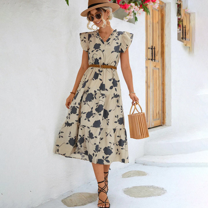 Vintage black V-neck midi dress for women, featuring elegant floral print, perfect for summer outings.