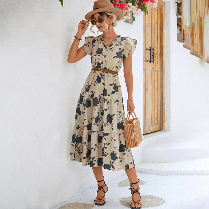 Vintage black V-neck midi dress for women, featuring elegant floral print, perfect for summer outings.
