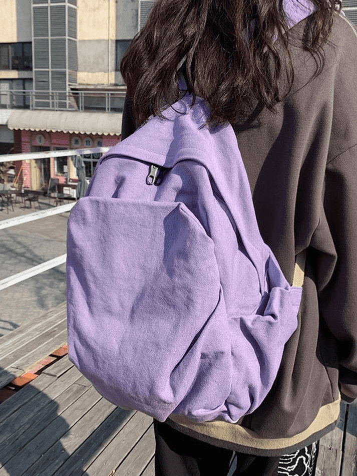 Lilac vintage wash canvas backpack, ideal for college, school, and daily student activities.