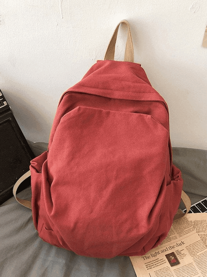 Red vintage wash canvas school backpack, unisex and stylish for university life.