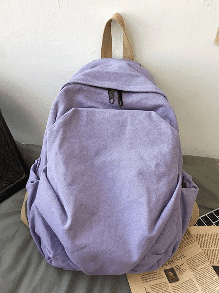 Lilac vintage wash canvas student backpack, perfect for college or high school campus.