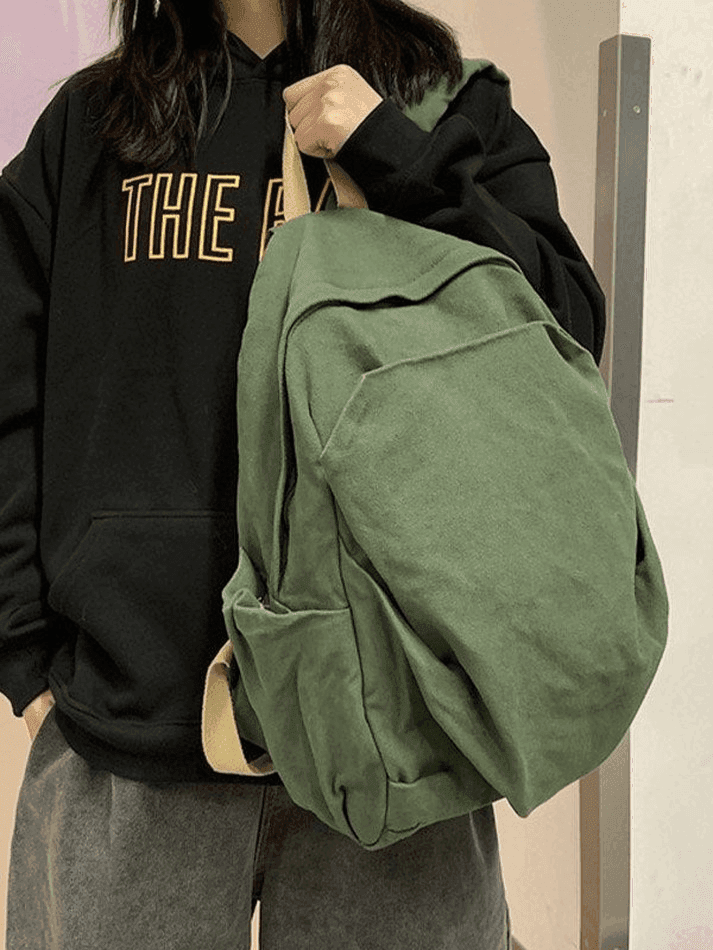 Black canvas vintage wash student backpack, unisex and great for school or university.