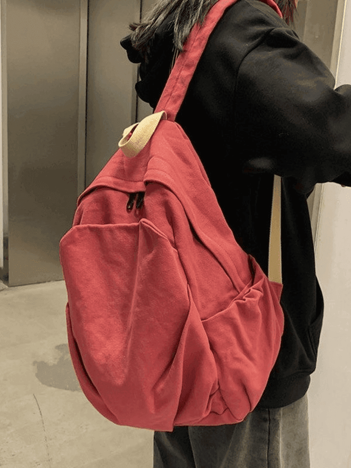 Red vintage wash student backpack, unisex canvas school bag for campus and daily use.