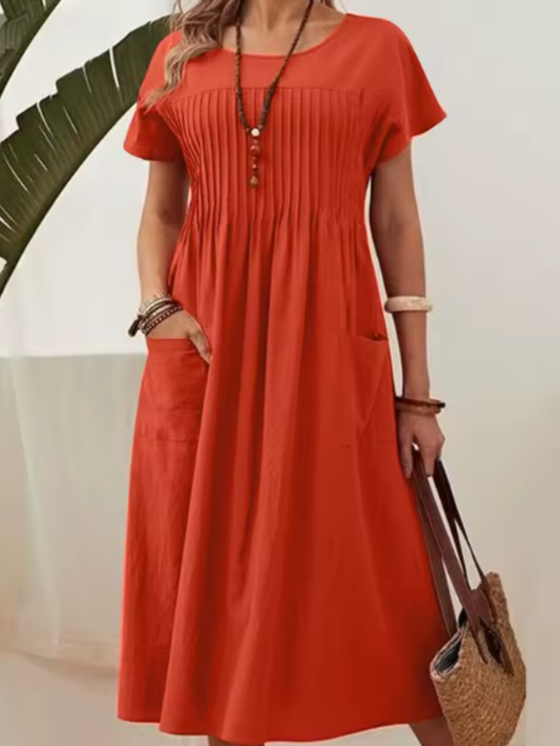 Effortless women's casual midi dress with pleated bodice & short sleeves. Perfect for summer fashion & relaxed style.