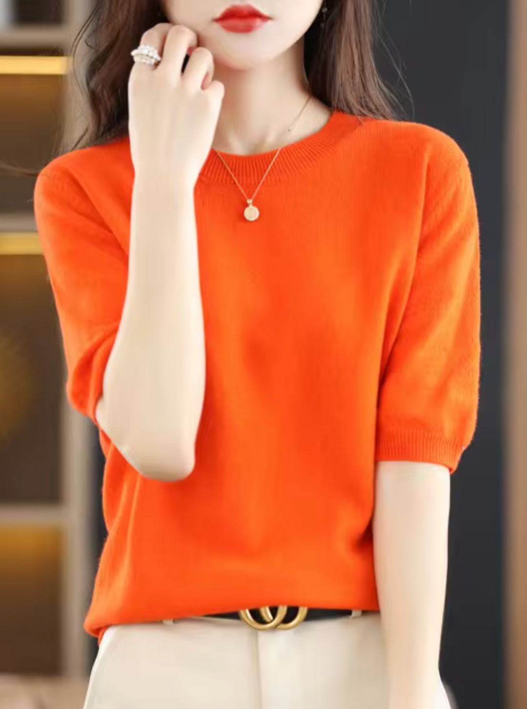 Cozy women's short-sleeved knit top. Elegant, chic, and versatile for modern everyday wear.