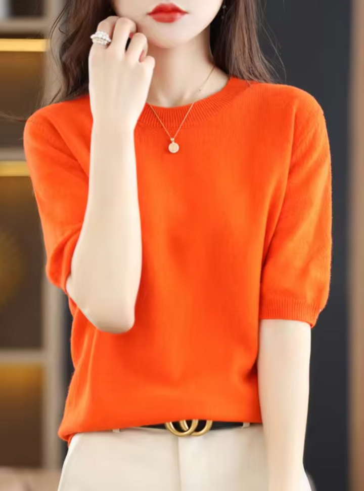 Cozy women's short-sleeved knit top. Elegant, chic, and versatile for modern everyday wear.