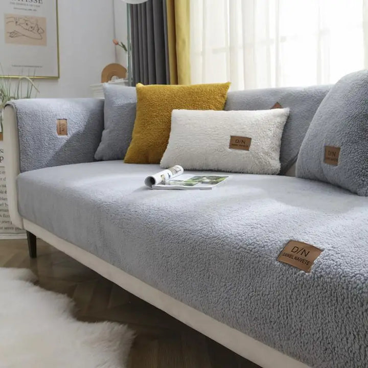 "Waterproof non-slip Sherpa fleece sofa cover in cozy faux lambswool texture, fits various sizes for ultimate comfort."