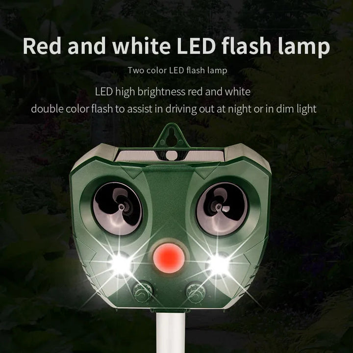 "Weatherproof solar ultrasonic animal repeller in garden, motion-activated to deter pests like cats and rodents."