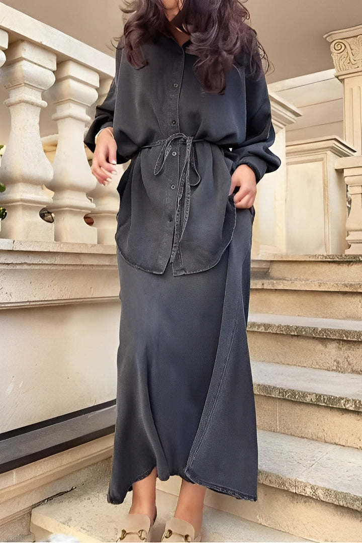Elegant women's button-up shirt and maxi skirt two-piece set, ideal for various occasions.