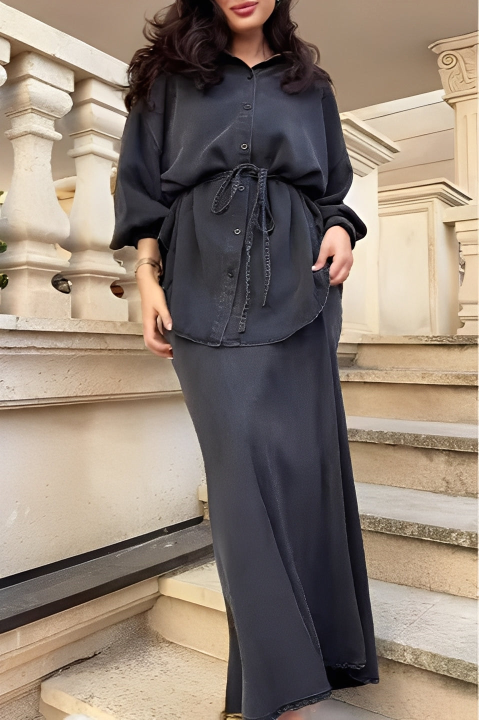 Women's elegant coordinated two-piece set featuring a button shirt and a flowing maxi skirt.