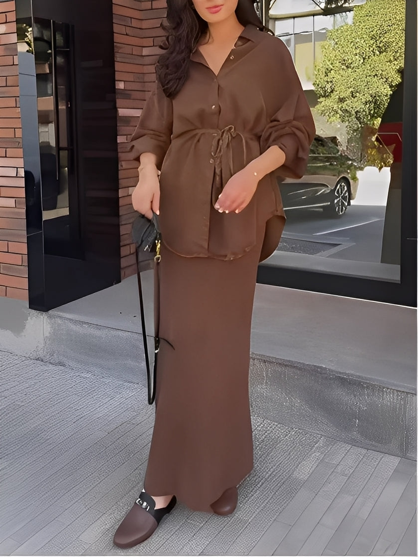 Stylish women's coordinated outfit: a button-up shirt paired with an elegant maxi skirt.