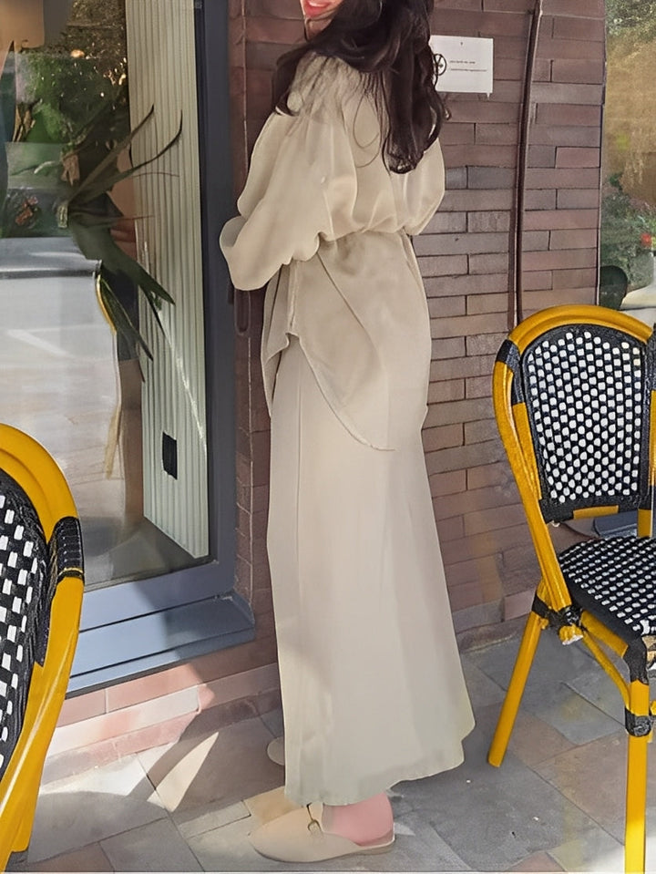 Chic women's coordinated button shirt and tie-waist maxi skirt set, perfect for seasonal fashion.