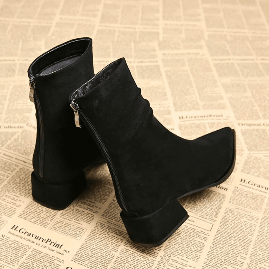 Women's stylish pointed toe block heel ankle boots, perfect for dressy or casual fall & winter looks.