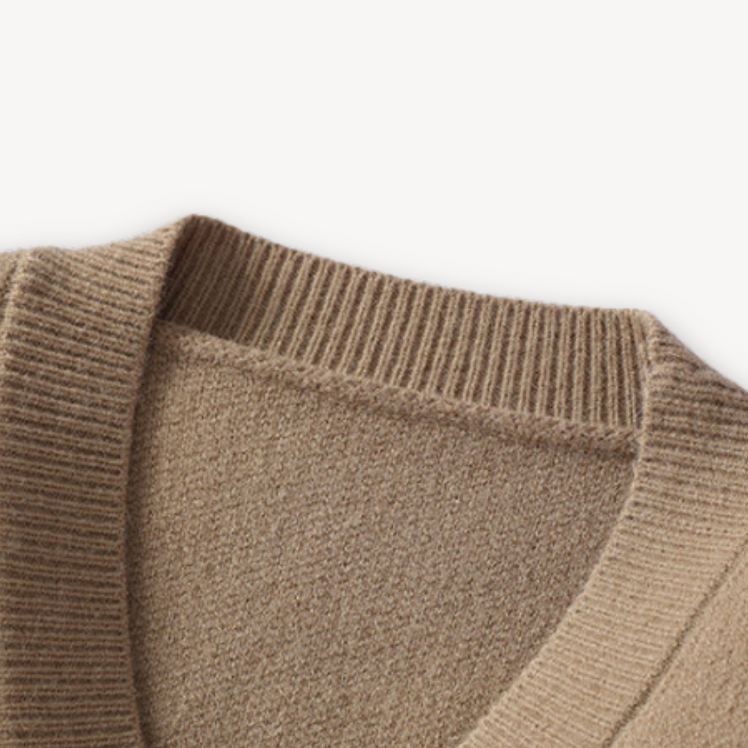 "White men's wool cardigan sweater with button-up front, ribbed cuffs, and black stitch detail for stylish winter wear."