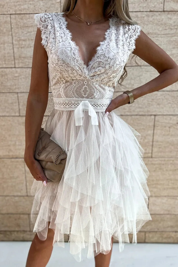 Elegant white ruffle mini dress for women, ideal as a party, cocktail, or evening dress. Sleeveless design.