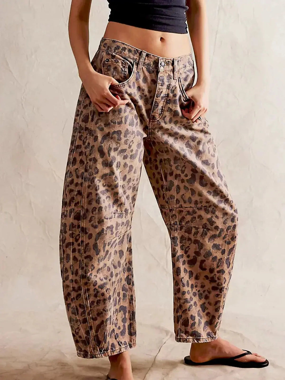 Women's high-waisted wide-leg leopard print jeans, perfect for a chic casual style.
