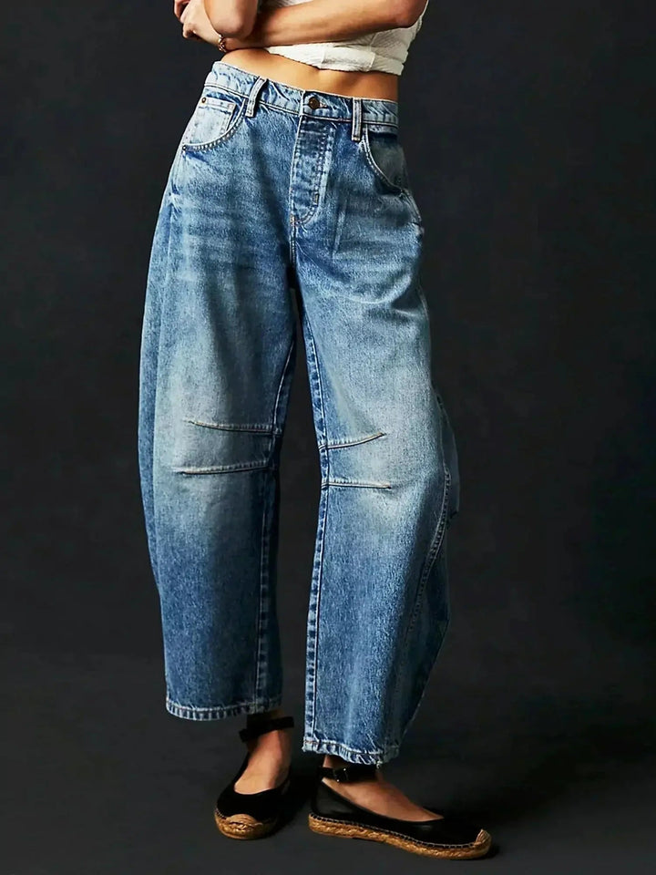 Comfortable high-waisted wide-leg leopard print jeans for women, bold & chic patterned trousers.