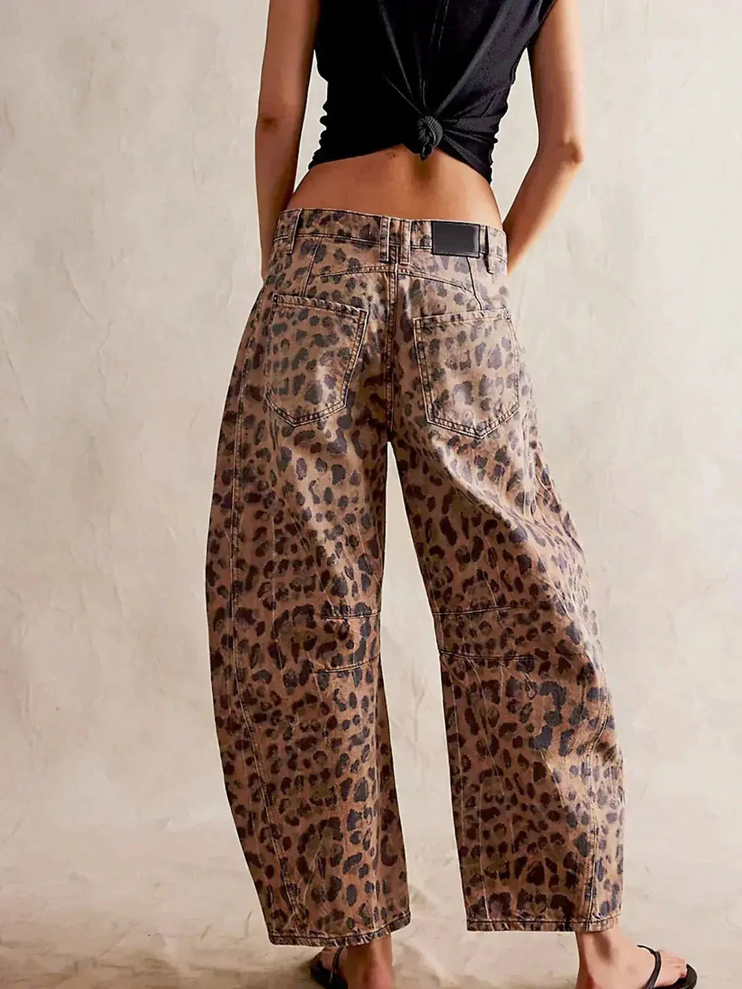 Chic women's high-waisted wide-leg leopard print jeans, comfortable animal print pants.