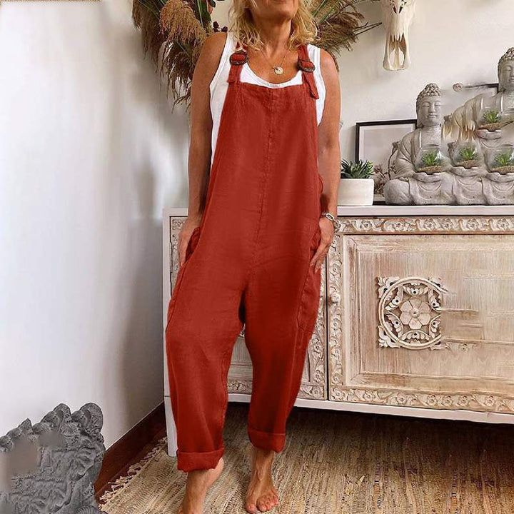 Women's wide-leg denim overalls with adjustable buckle straps, multiple pockets, and a comfortable, loose fit for casual spring/summer style.