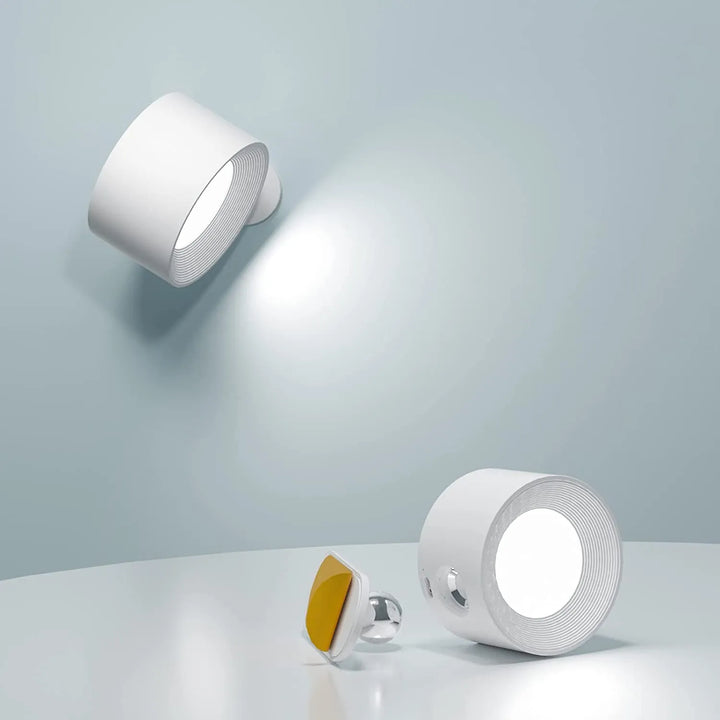 Wireless LED wall light, stick-on, black and white, cordless, for indoor and outdoor use, emits warm white glow, energy-effic