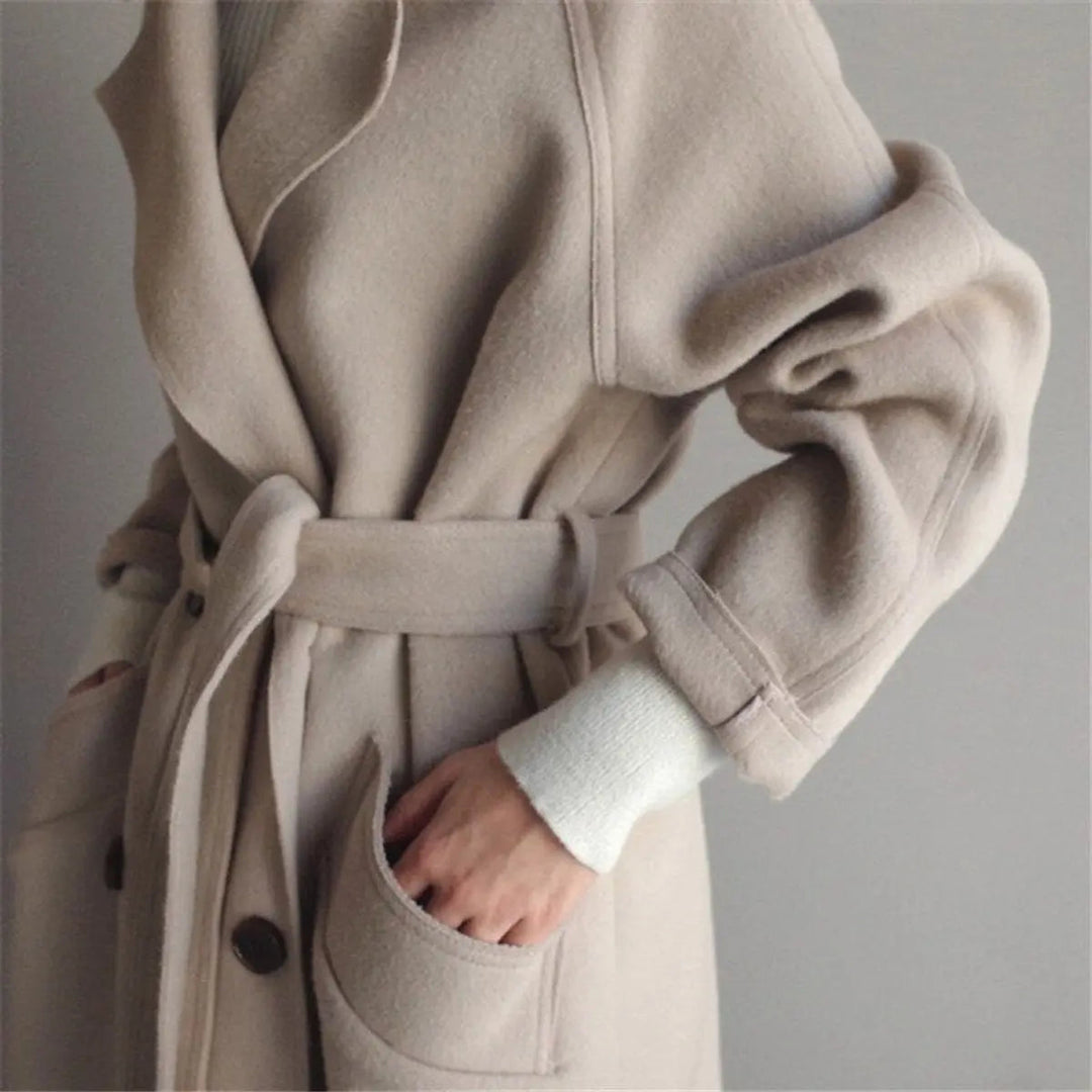 Classic tailored women's long double-breasted cashmere coat for elegant winter and fall outerwear.