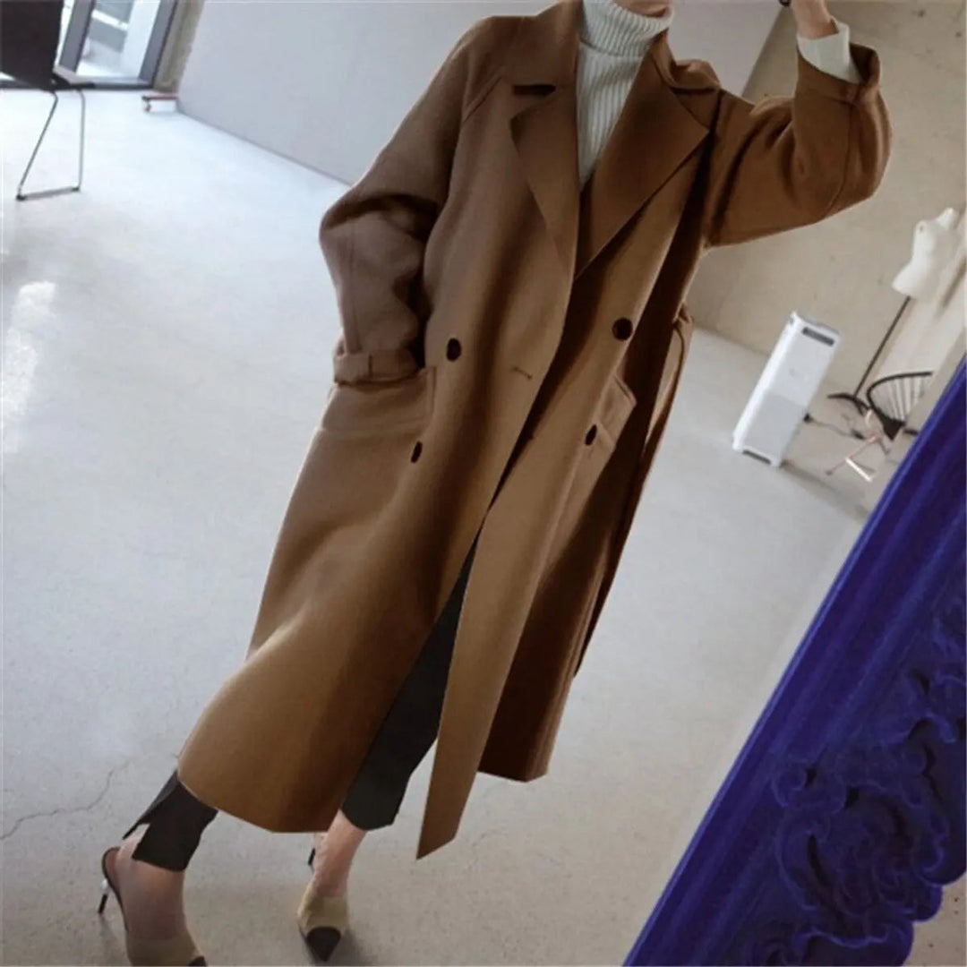 Luxurious women's double-breasted long cashmere overcoat, a warm & elegant choice for cold weather style.