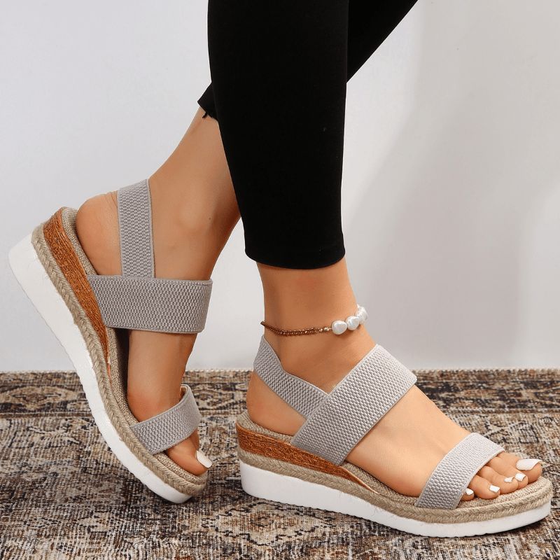 Easy slip-on women's platform sandals featuring adaptive comfort and trendy stretch straps for summer.