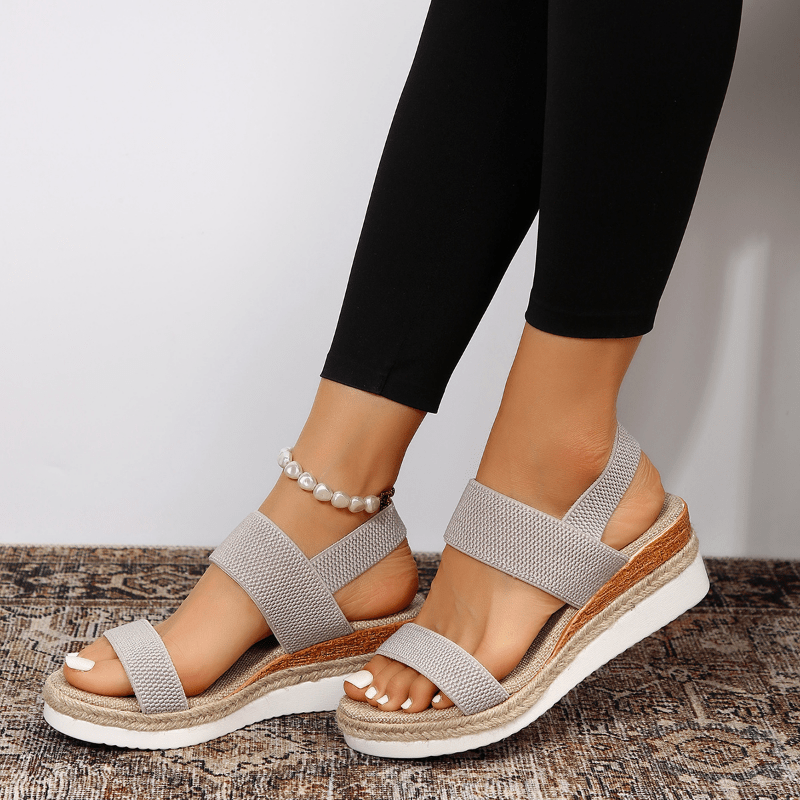 Modern women's platform sandals with flexible stretch straps, ensuring adaptive comfort for any outfit.