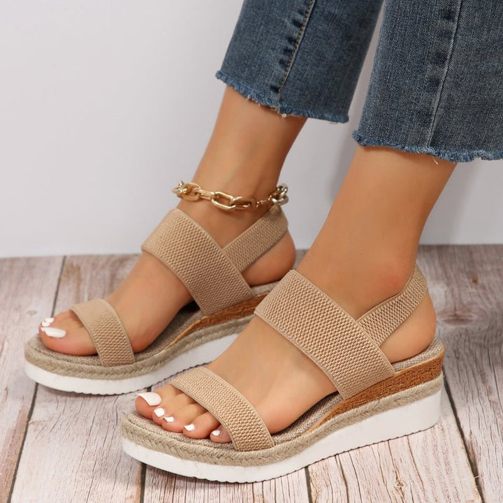 Chic women's slip-on platform sandals. Features stretch straps for ultimate adaptive comfort & style.