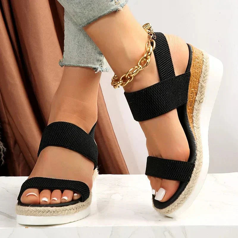 Front view of women's fashion platform sandals. Features wide, comfortable stretch straps for easy slip-on wear.